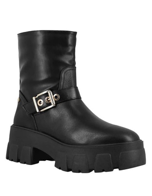 Bota al tobillo de piel para mujer