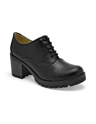 Zapato de piel para mujer