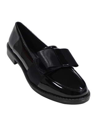 Zapato de charol para mujer