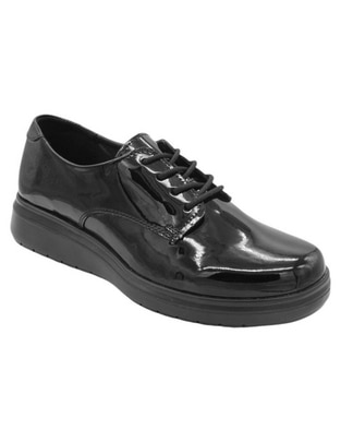 Zapato de charol para mujer
