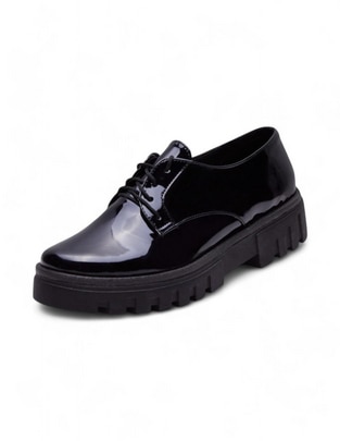 Zapato de charol para mujer