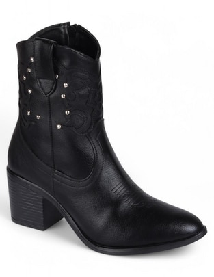 Bota arriba del tobillo de piel para mujer