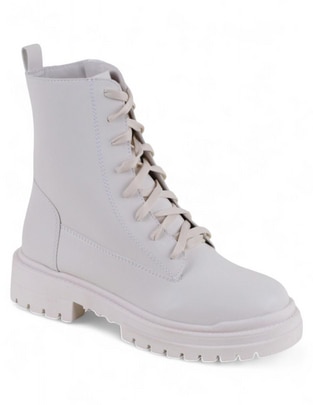 Bota arriba del tobillo de piel para mujer